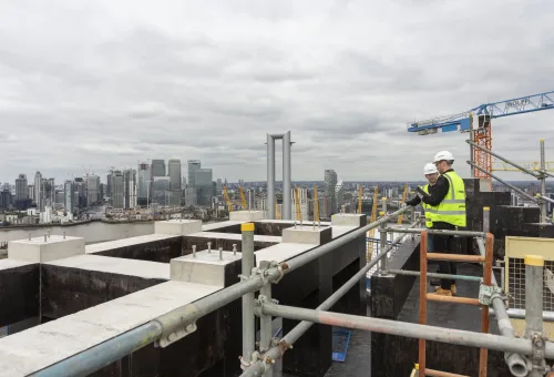 Construction site in Greenwich, London with Mace Construction Co., Inc.workers on site.